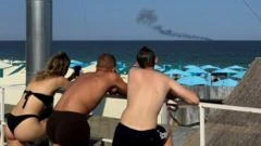 O balneário de luxo da Ucrânia onde turistas convivem com bombardeios diários: 'Todos ficam na praia observando os mísseis no céu'